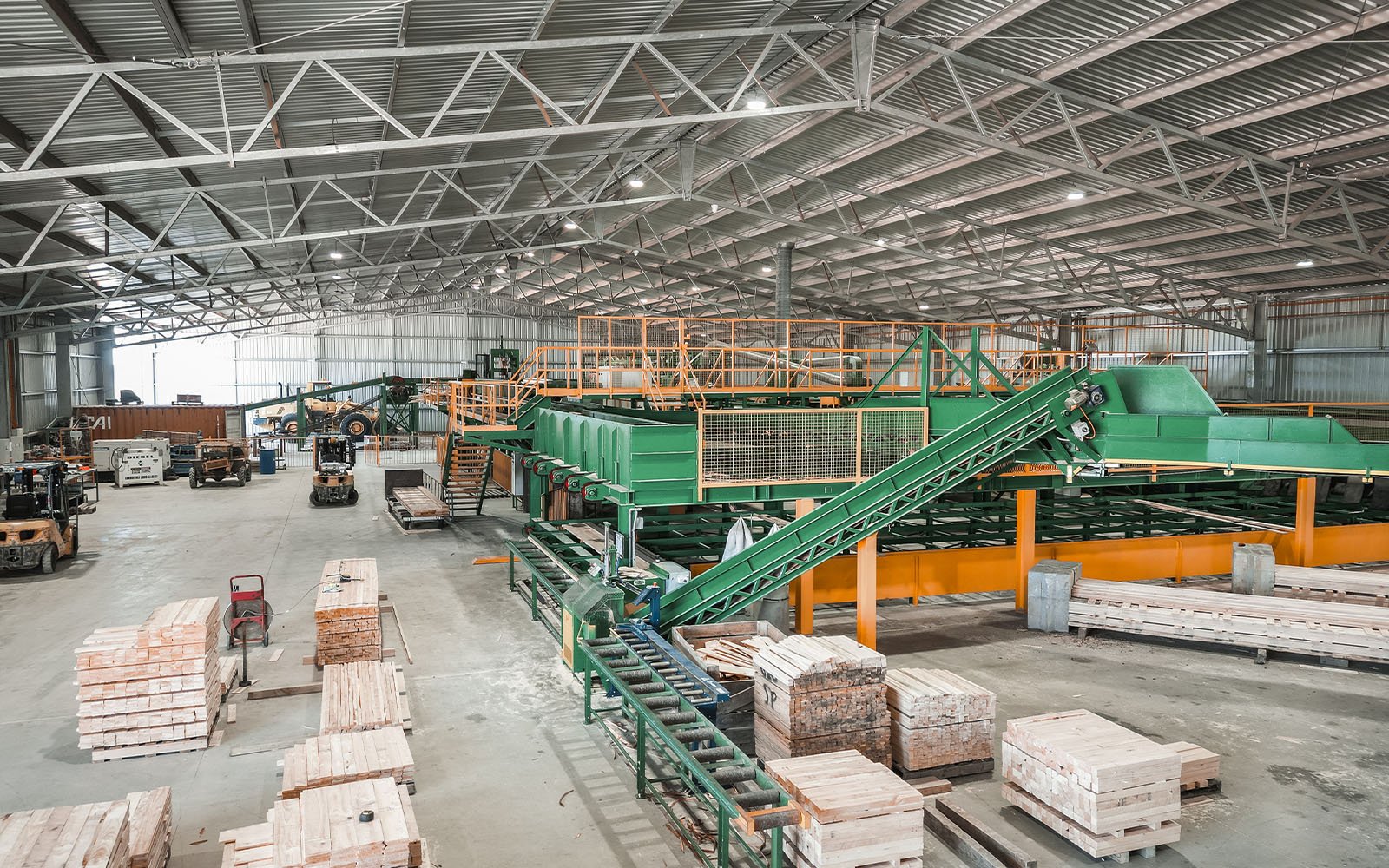 Inside Morgan Sawmill’s steel-framed industrial shed showing timber production equipment and wide-span structural design by Central Steel Build.