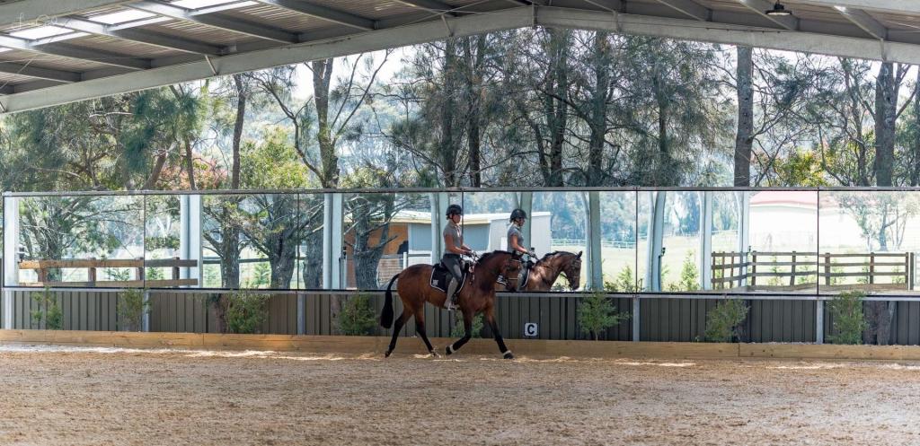 covered dressage arena with mirrors