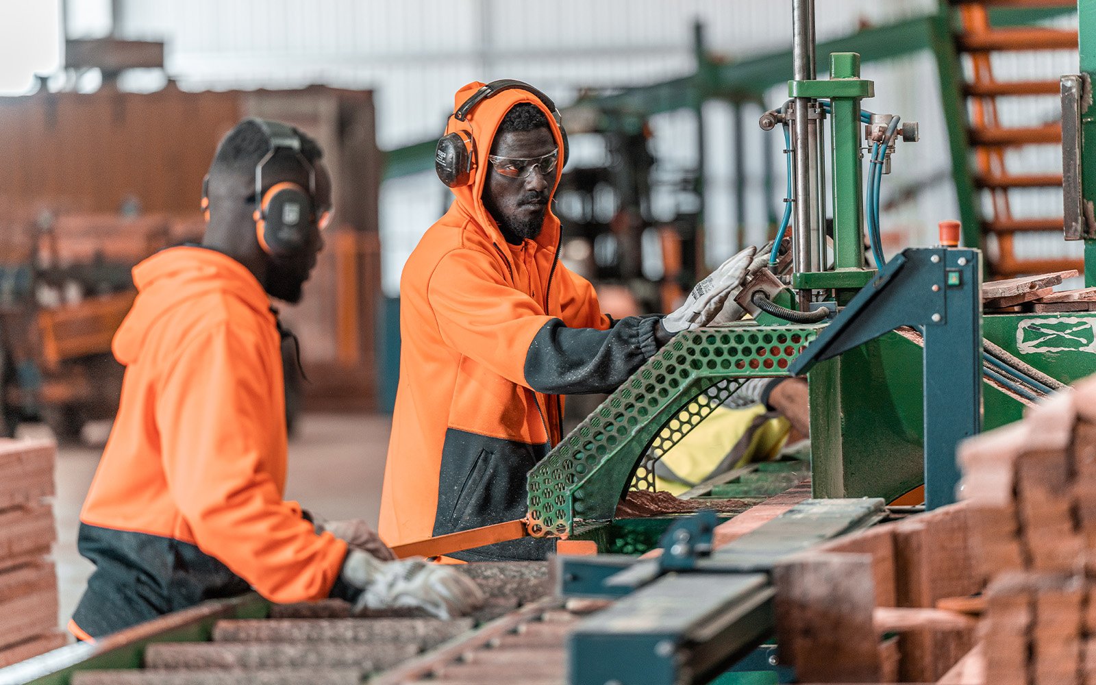 Workers operating timber machinery inside Morgan Sawmill’s purpose-built industrial steel building in Dublin, South Australia, constructed by Central Steel Build.