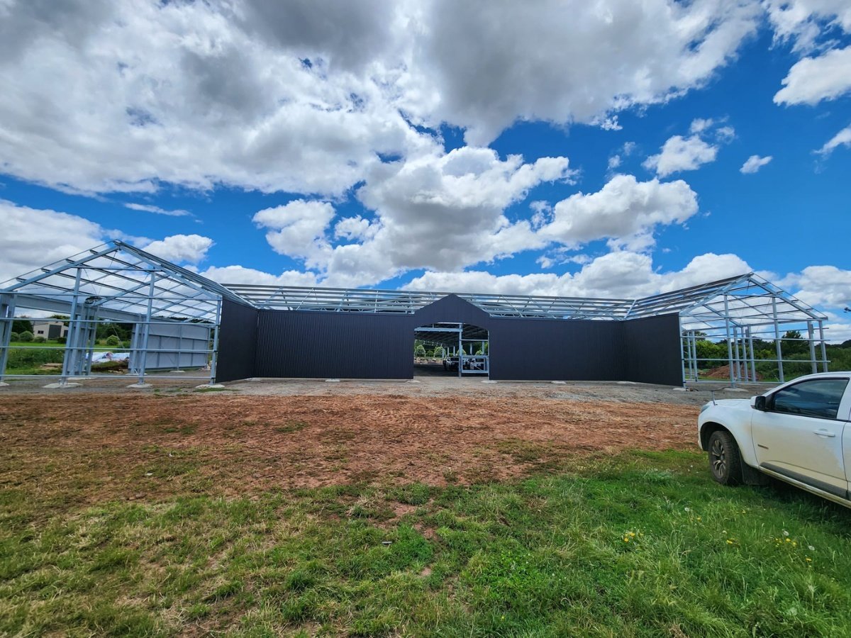 Combined indoor dressage arena and stable complex