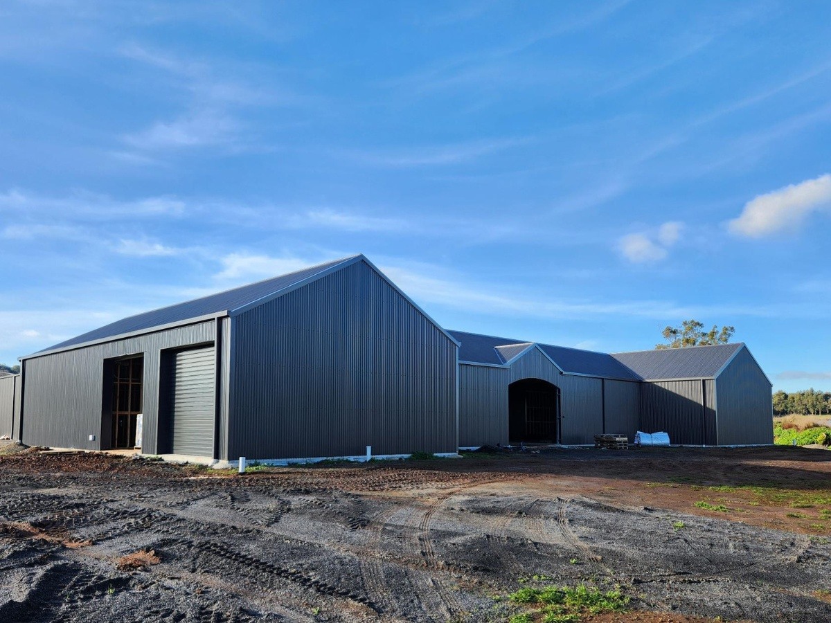 Combined indoor dressage arena and stable complex
