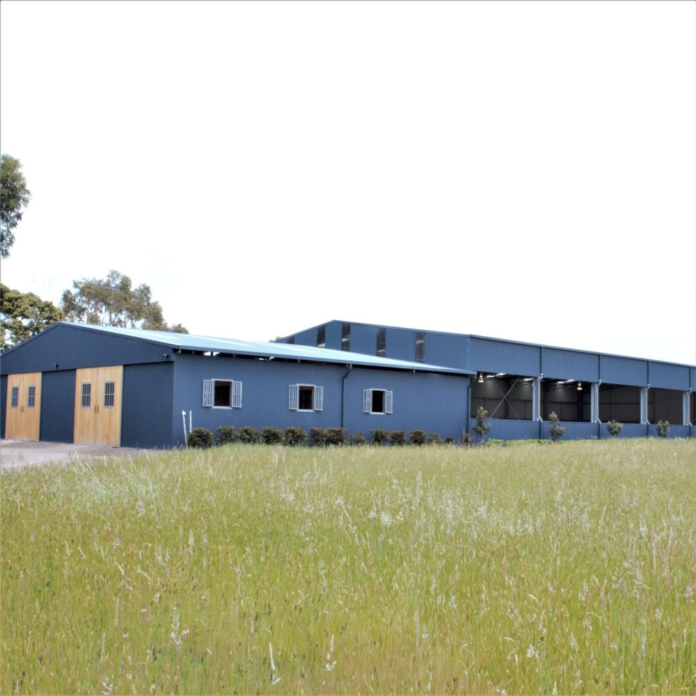 Indoor arena and stable complex