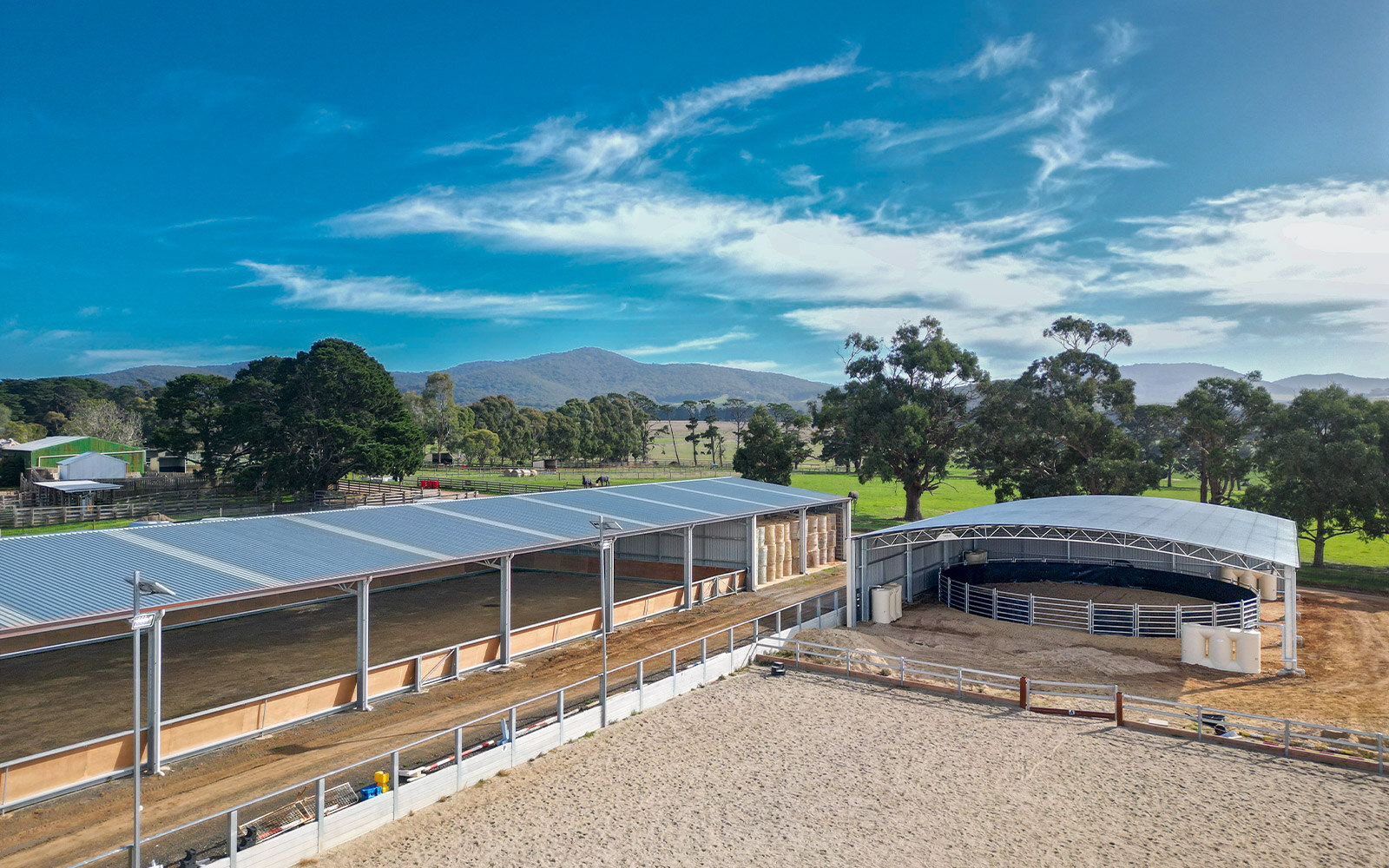 An equestrian arena and round yard cover, both made from hot dipped galvanised steel, in Riddells Creek, Victoria.